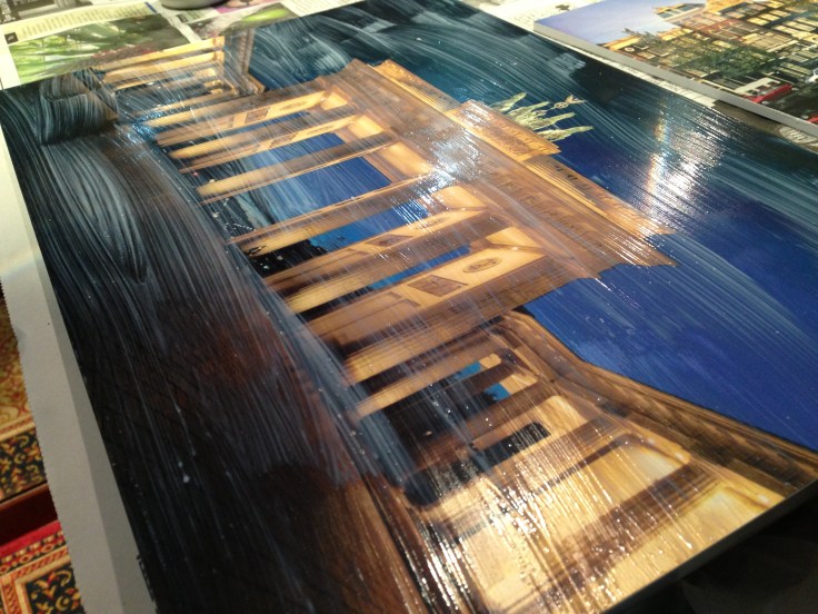 Applying the mod podge on the surface of the prints itself. 